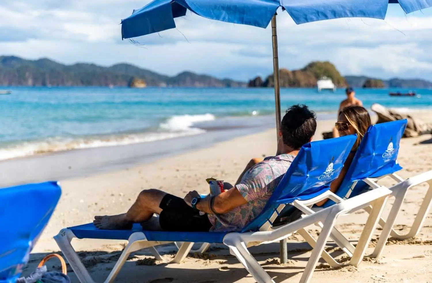 People relaxing beach side